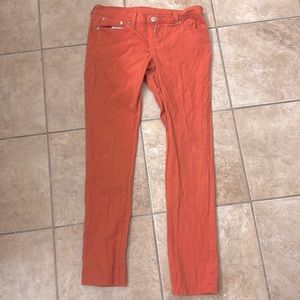 Coral color skinny jeans by Rue21